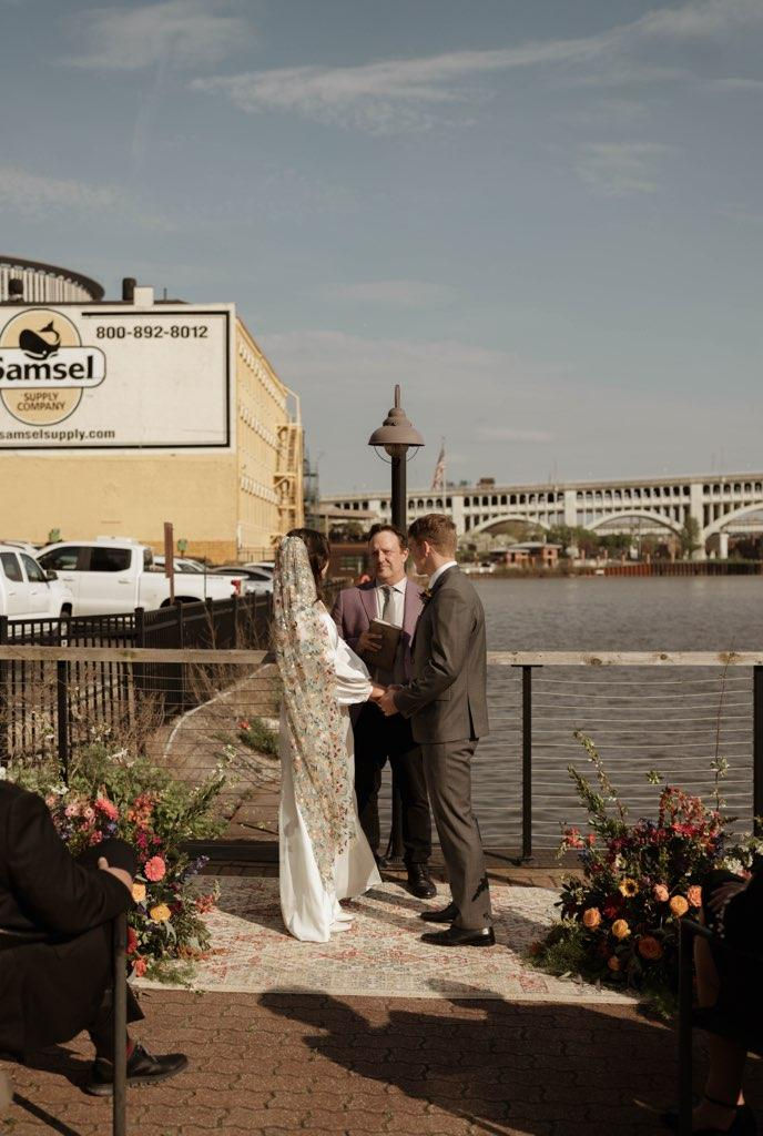 A couple exchanges vows in an intimate micro-wedding ceremony at Collision Bend.