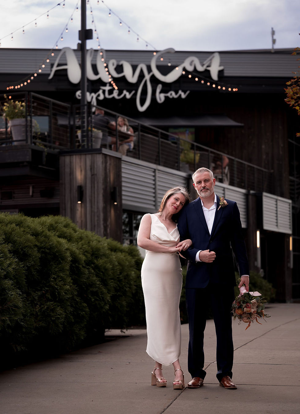 Bride and Groom outside Alley Cat Oyster Bar after they shared vows during their micro wedding.