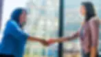 Reliable Customer Support Photo. Closing deal with a cusotmer infront of window.webp