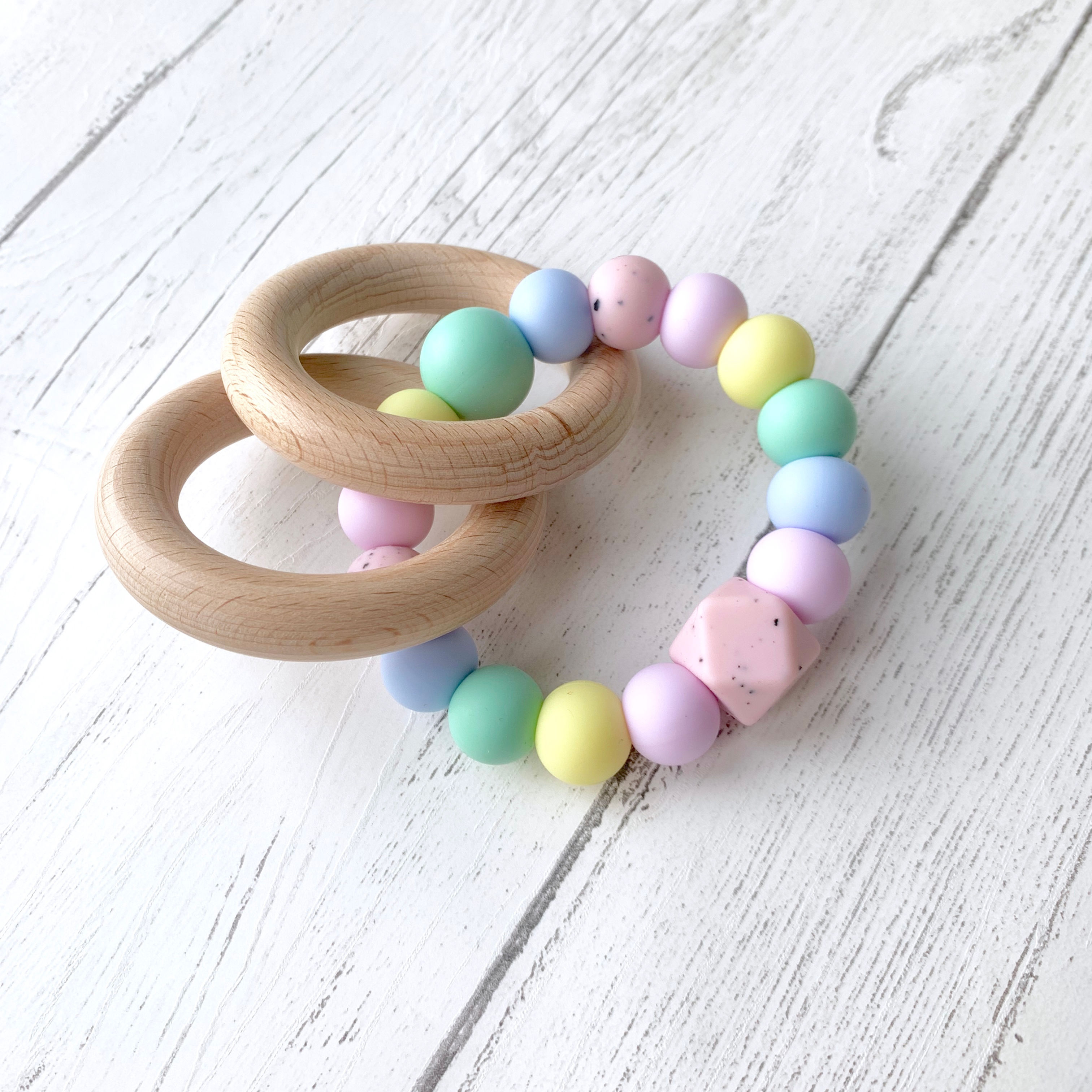 Natural wood ring rattle toy