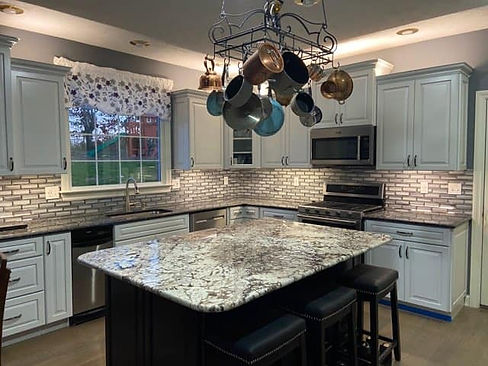 White Kitchen with Tile Backsplash and Granite Countertops