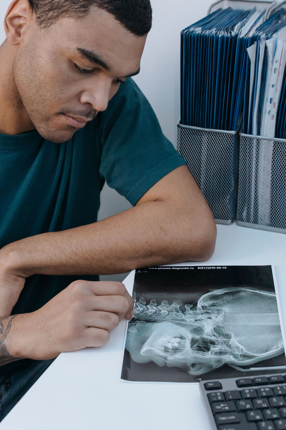 Clinician discussing imaging and treatment options with a patient