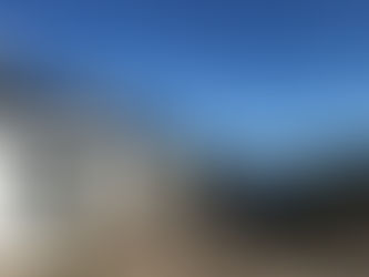 Picture of Glenuig inn with the bay in the background