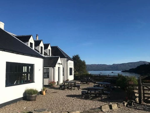 Picture of Glenuig inn with the bay in the background