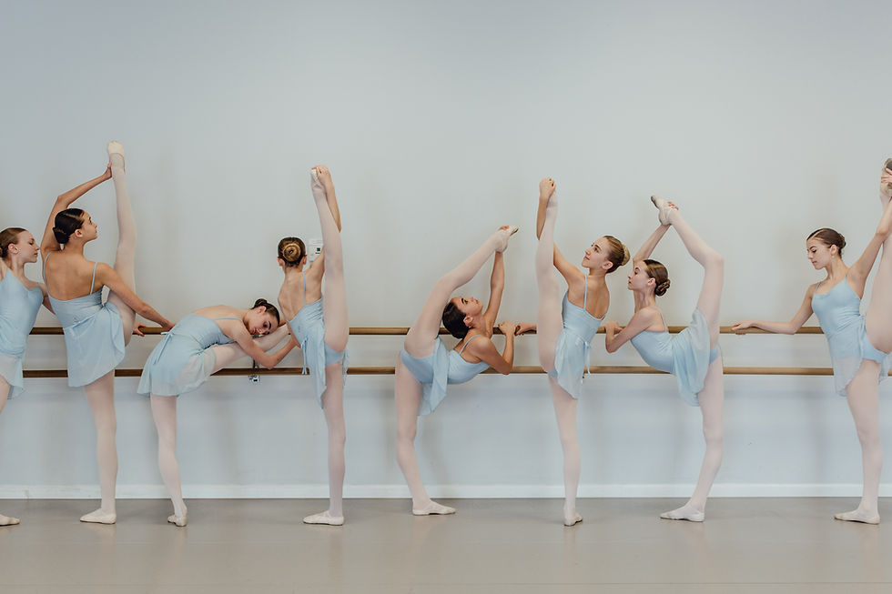 Master Ballet Academy students stretching at barre