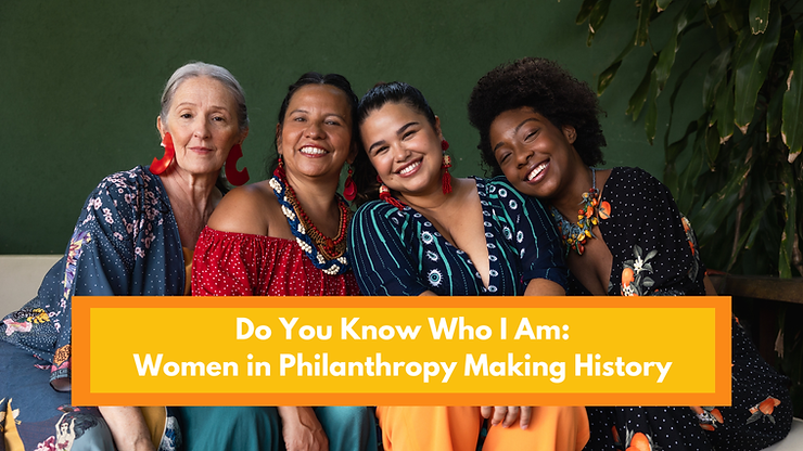 Four women on a couch smiling. From left to right, the women are white, brown, tan and Black.