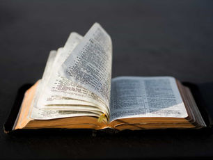 Image of a Bible with the pages open representing the biblical basis for a church capital campaign.