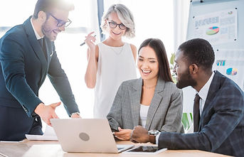 stock-photo-multicultural-businesspeople-laughing-while-working.jpg