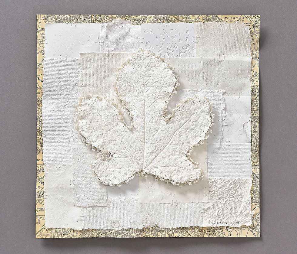 White handmade paper art. It incorporates a paper leaf casting
