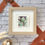 Thumbnail: Succulent in Green miniature watercolor painting by Sheryl Brake framed with rust ribbon accent