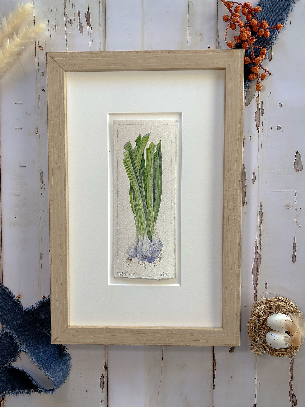 Thumbnail: watercolor painting of a bunch of green onions by Sheryl Brake, framed with blue ribbon accent
