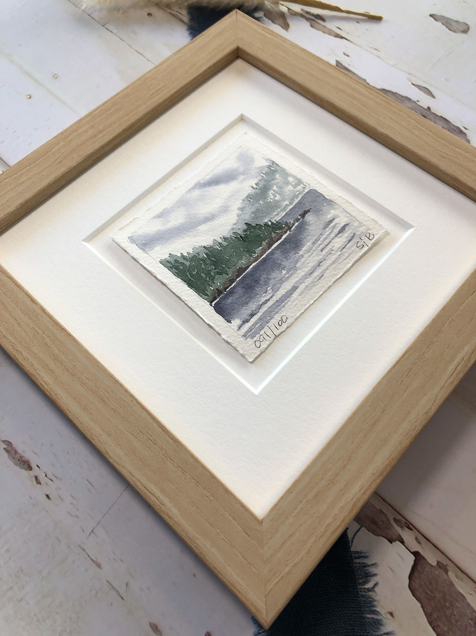 Thumbnail: miniature landscape painting of misty morning on a mountain lake, 3"x3", subtle greens and blues, frame details