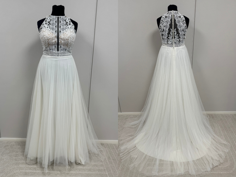 Ladybirdin halter neck -mallinen hääpuku pehmeällä tyllihelmalla ja illuusioselällä. Koko 42, pituus 179cm. Hinta 900€.