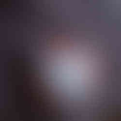 Close-up of a soft blue heart prop held by newborn baby Eliab during Aurora newborn photography session