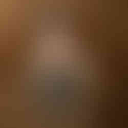 Newborn baby Eliab posed in a wicker crib prop wearing a knit hat during Aurora newborn photography session