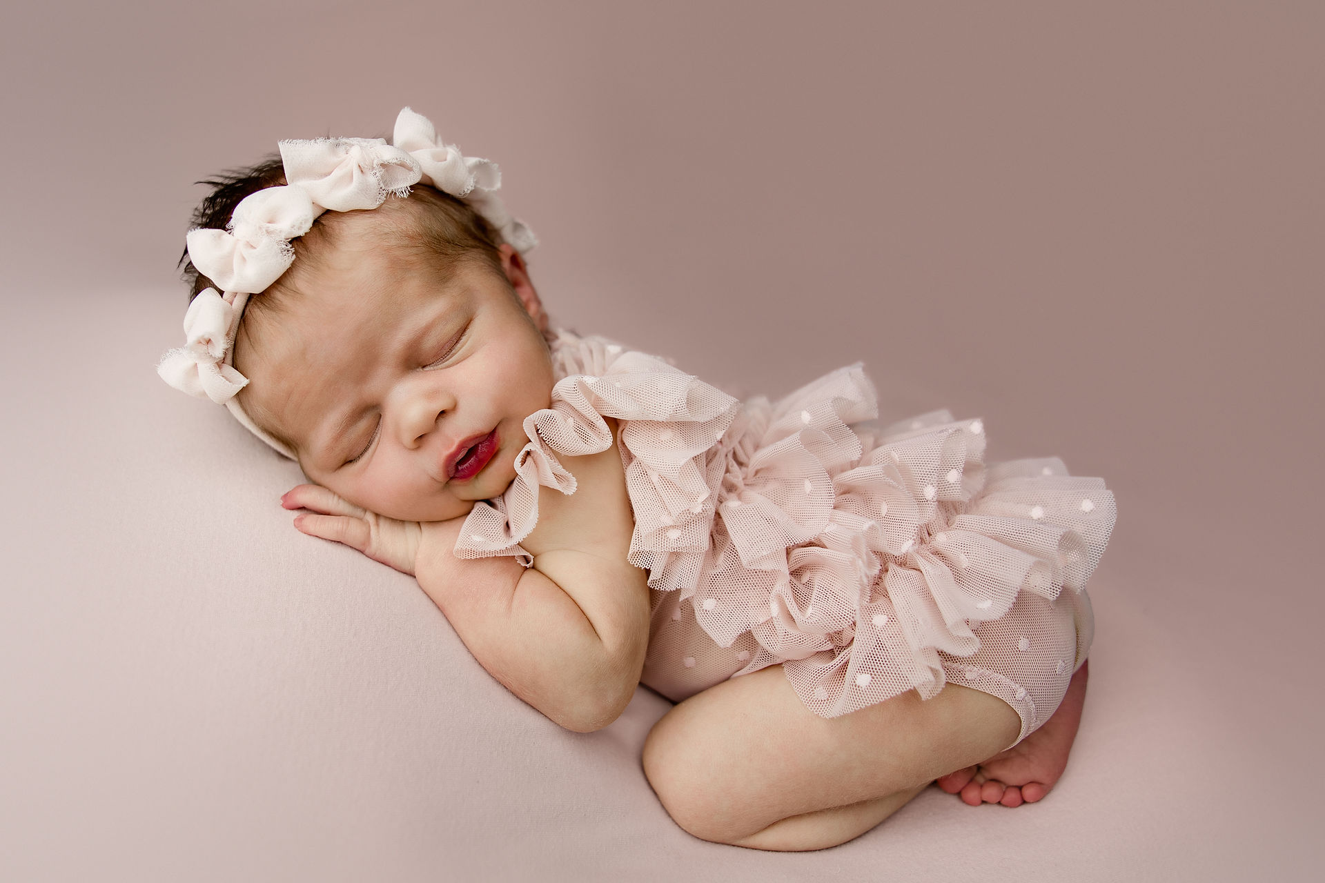 Baby girl newborn photography collage featuring Wrenlee in soft pink, lavender, gray and neutral studio setups in Aurora, Colorado.