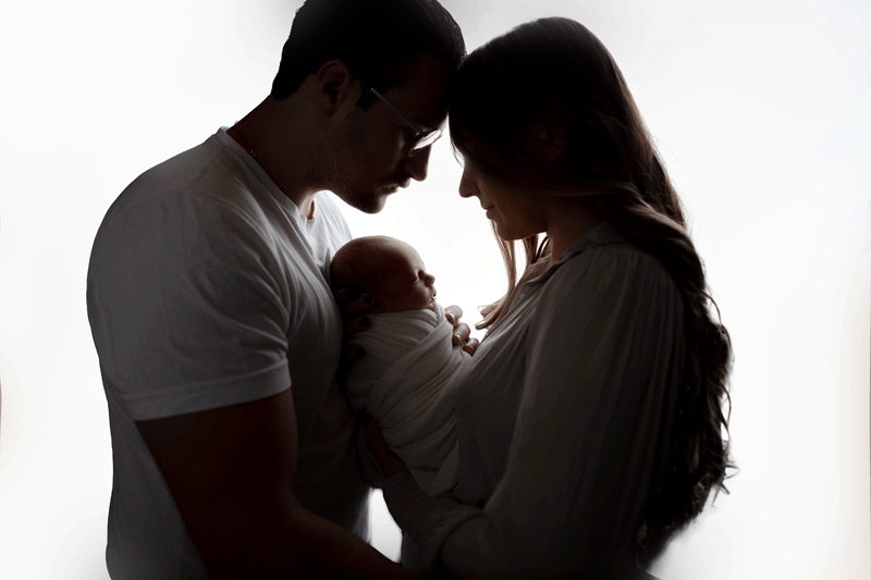 Aurora Colorado | Newborn Photographer | Tiny Details Photography | Newborn baby boy id welcomed with love is this family backlit image