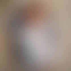 Newborn baby Eliab wearing a soft blue outfit posed on a neutral plaid background during Aurora newborn photography session