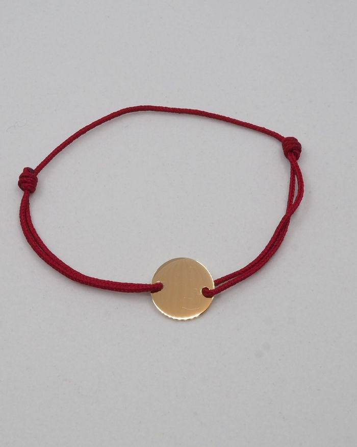 Bracelet médaille sur cordon