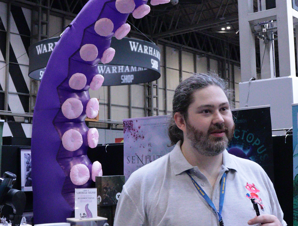Photograph of George E Ohh in front of a giant inflatable tentacle