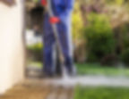 Power washing the area around the house