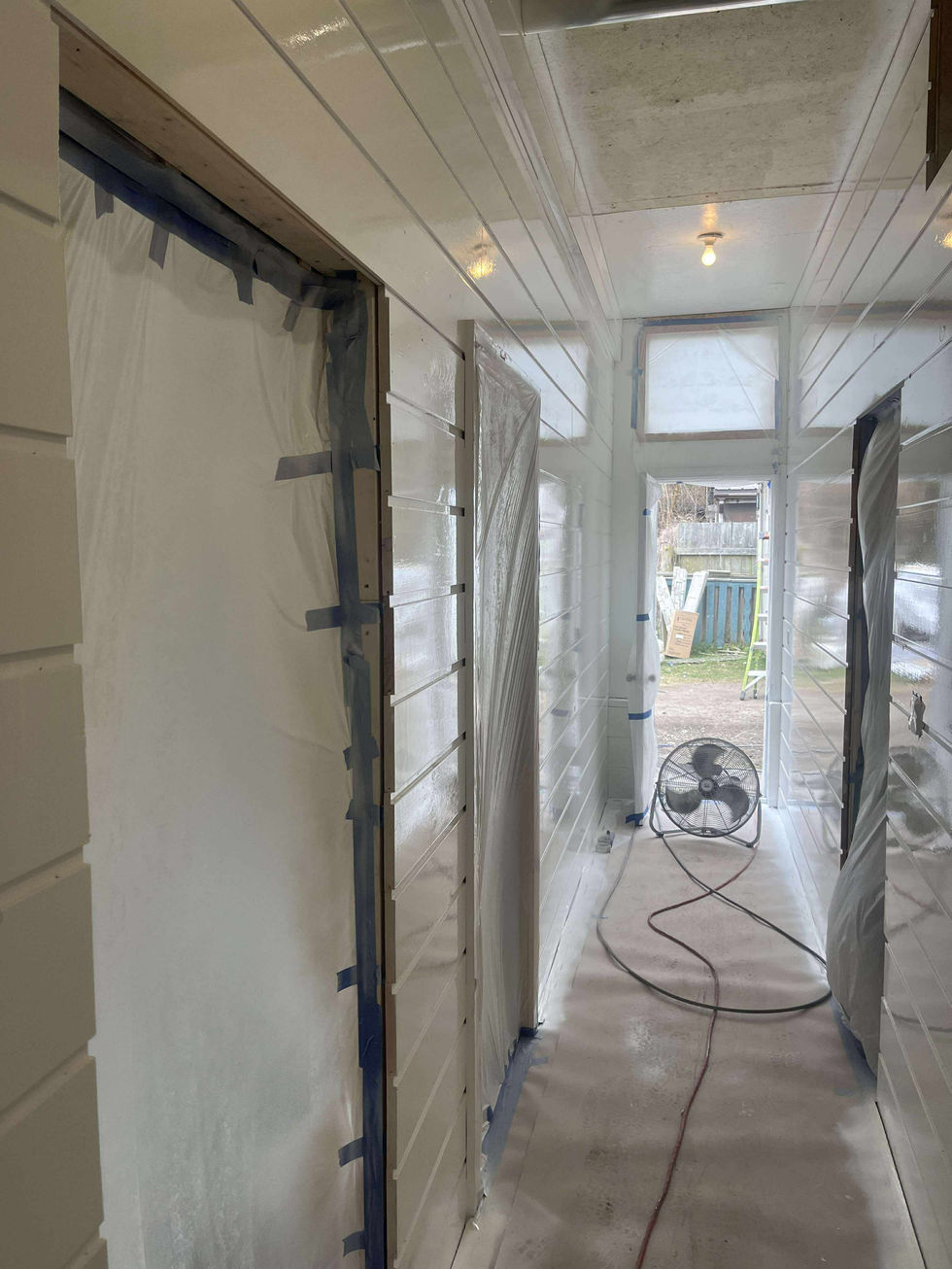 Taped off hallway prepping for interior paint