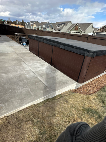 Broom finish concrete hot tub pad