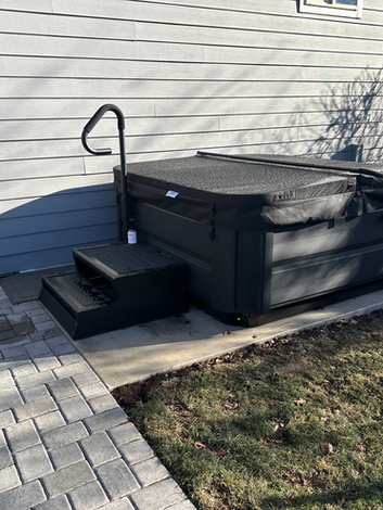 Broom finish concrete hot tub pad