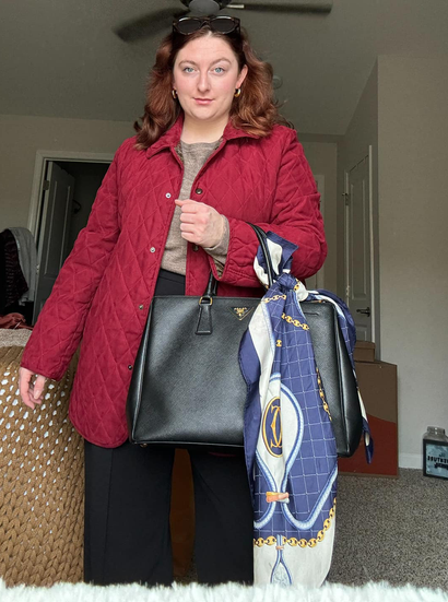 Taylor with red coat and cute bag with scarf attached