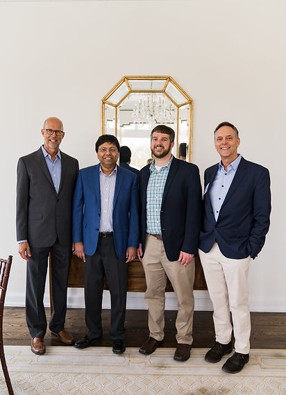 Institute co-founders Dan Kautz and Woody Uible pictured with Institute Director Debashis Pal and Kautz-Uible Cryptoeconomics Lab Director Michael Jones.