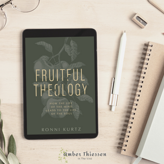 book cover of fruitful theology on a white desk with notebooks and glasses