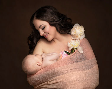 Smiling mom holding her newborn