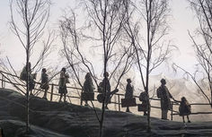 Von Trapp family in a line on the mountains