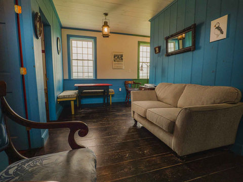Living room area with couch and tables