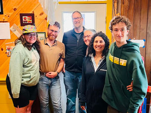 Six members of a wedding party pose together at West Quoddy Station in Lubec, Maine.