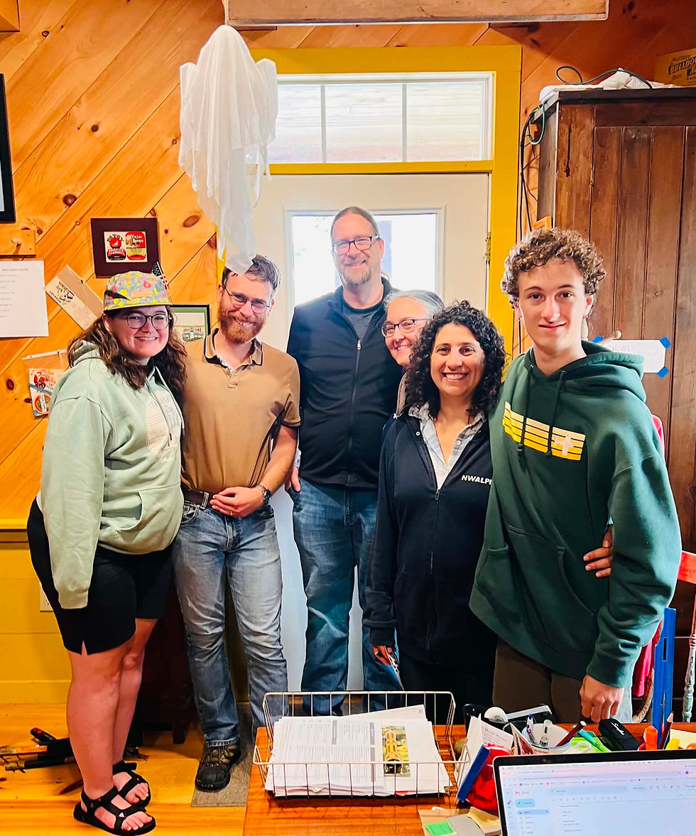 Six members of a wedding party pose together at West Quoddy Station in Lubec, Maine.