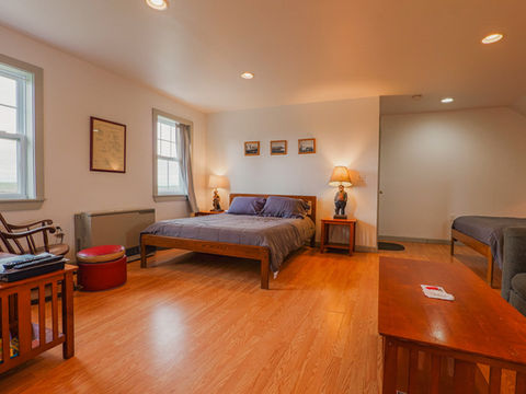 Open space with bed and night stands