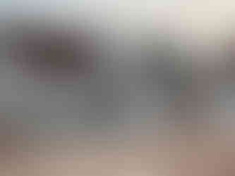 Lubec Memorial Library building on Water Street in Lubec, Maine, with snow along the sidewalk and street corner view.