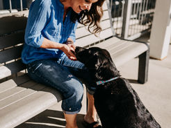 woman and dog at train station