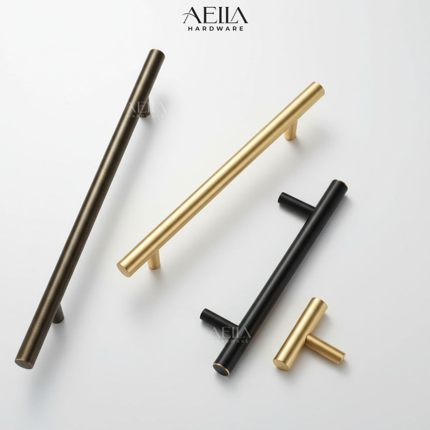 AELLA HARDWARE: Various cabinet pulls displayed, in bronze, gold, and black finishes.