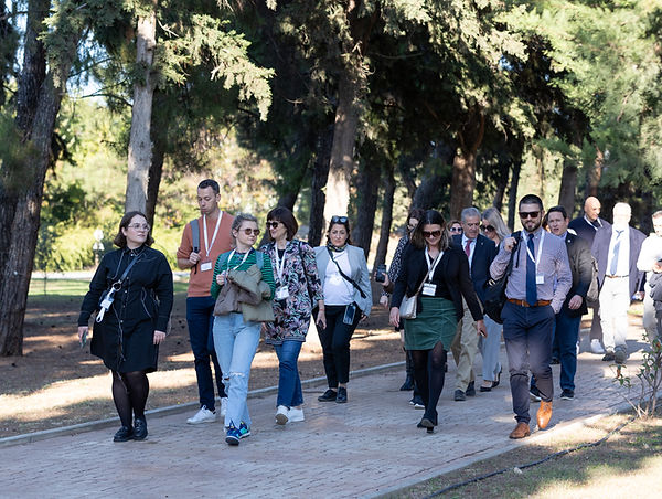 A group of student affairs professionals walk in a nice venue