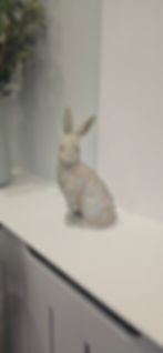 An ornate statue of a rabbit, decorated with gold leaves, sat on a mantle piece in Shedfield Lodge Dementia Specialist Care Home near Wickham