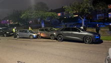 Two parked cars suffered substantial damage in a collision in New Parks