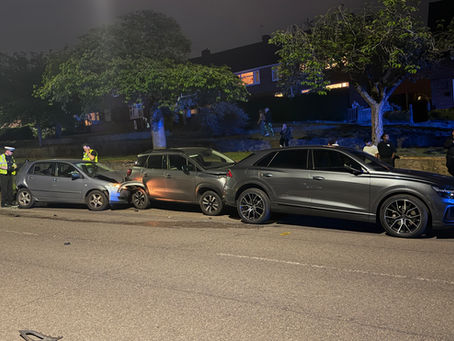 Two parked cars suffered substantial damage in a collision in New Parks