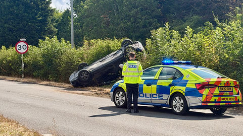Car flips and overturns onto central reservation in Blaby.