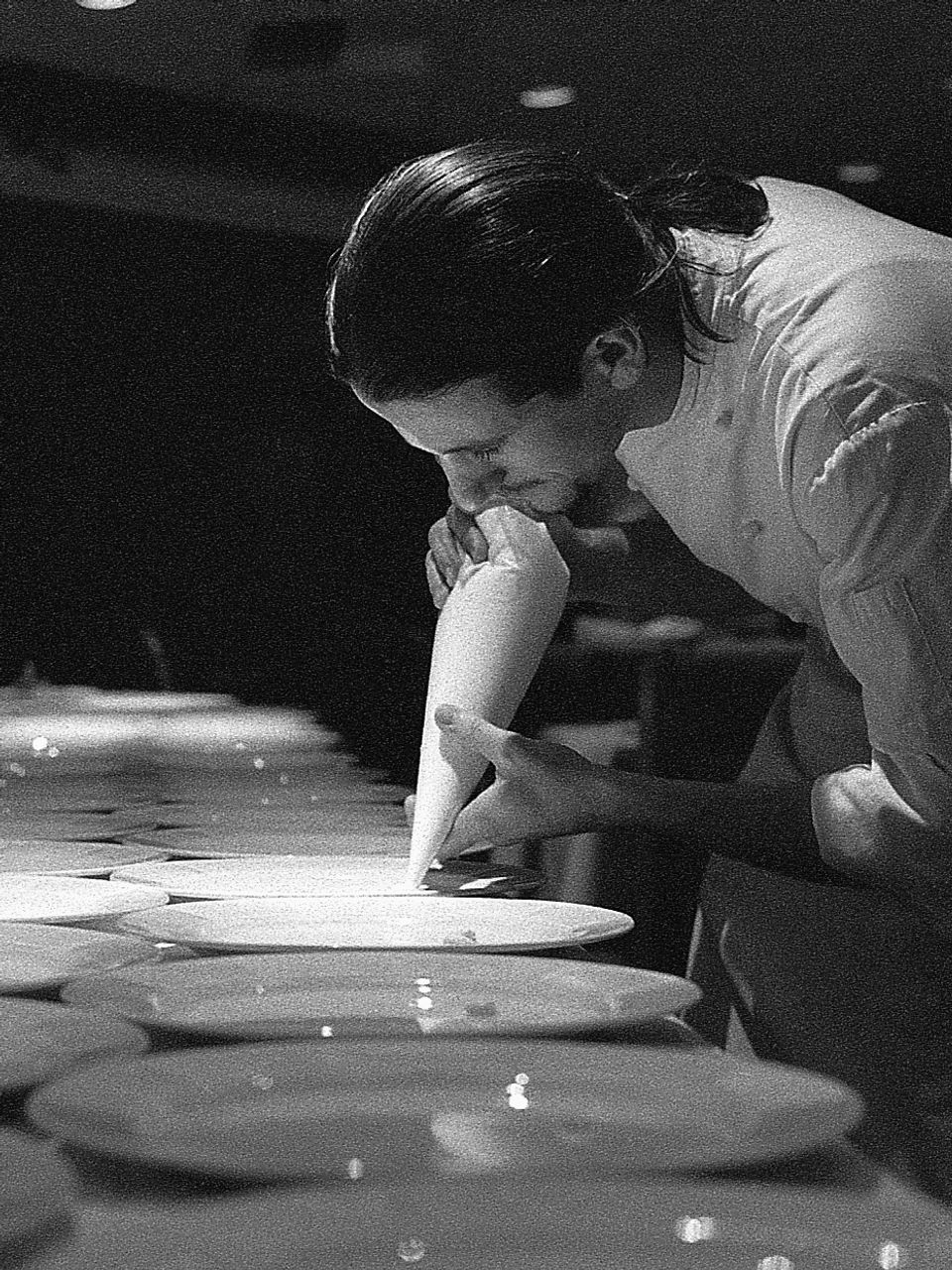 Top Chef applying final touches at an exclusive corporate event. Food and wine photograph by Gina Taro