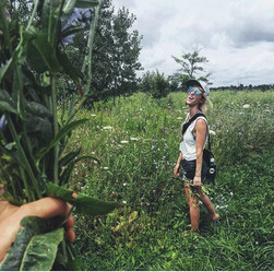 someone standing in a very green field