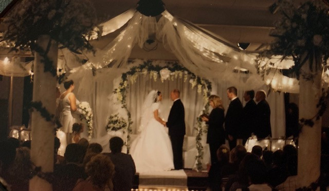 Bride and Groom at Alter Getting Married
