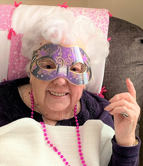 resident wearing a masquerade mask