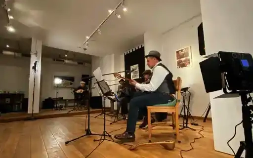 Musicians playing a live session in a gallery space